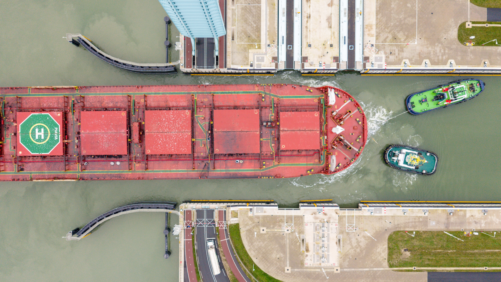 Photo of the PIAVIA ship in the New Terneuzen Lock during the wider ship trial voyage to ArcelorMittal Ghent.